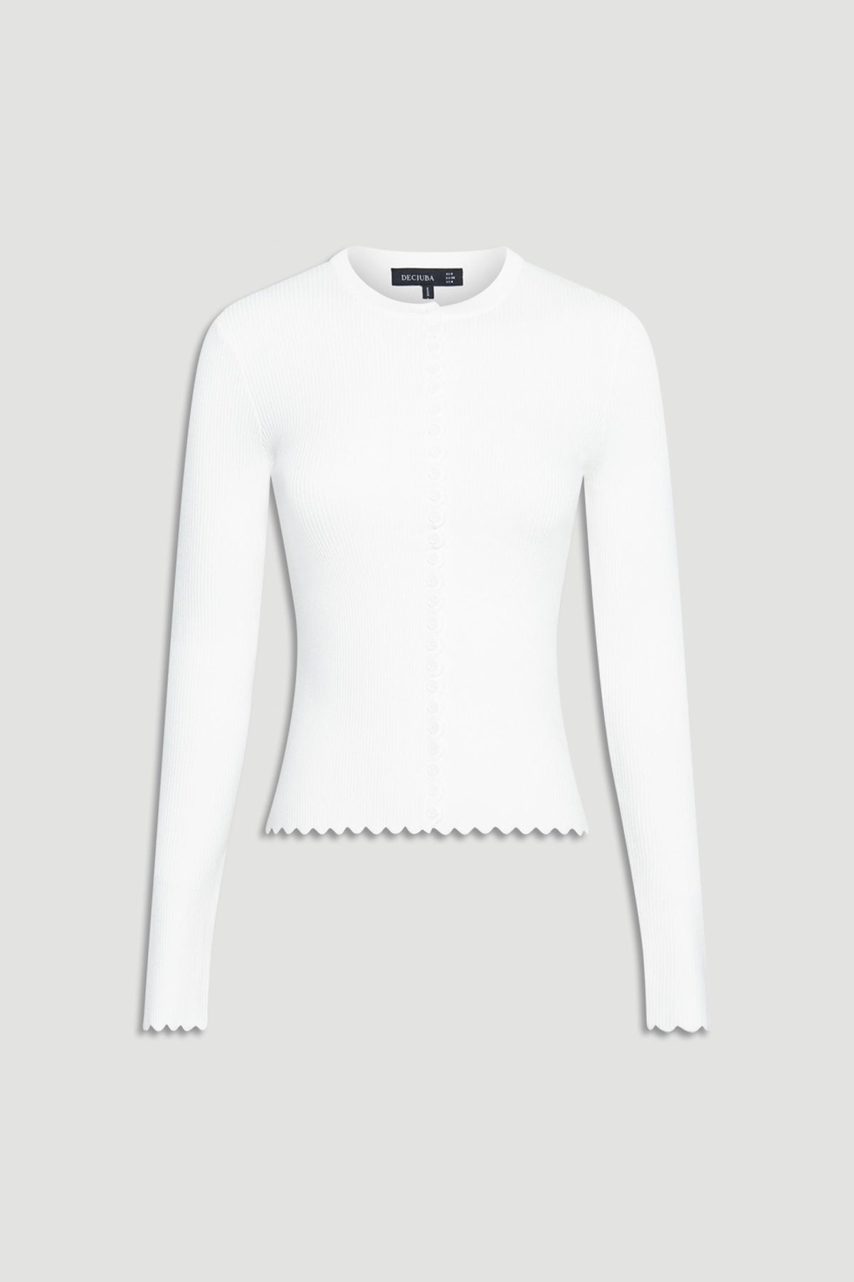 White fitted long-sleeve top featuring subtle scalloped edges on cuffs and hem with delicate button detailing down the front