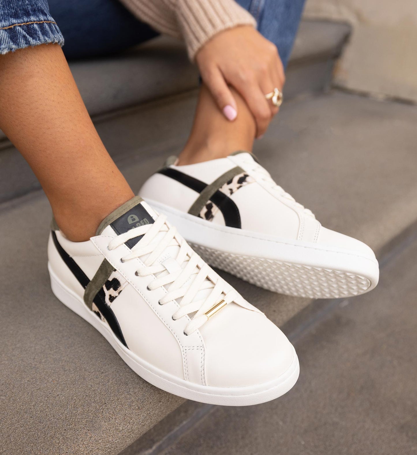 women's ecru leather sneaker with black and leopard print detailing