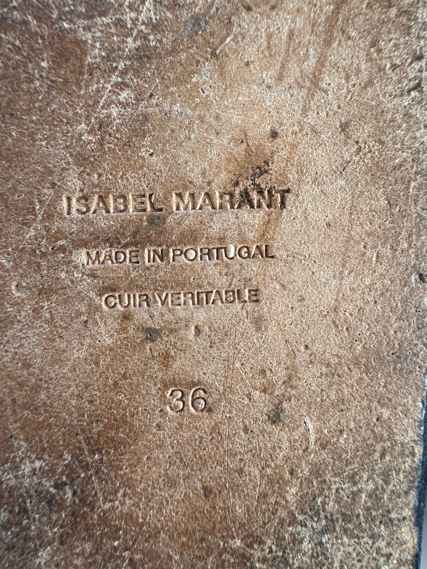 167023