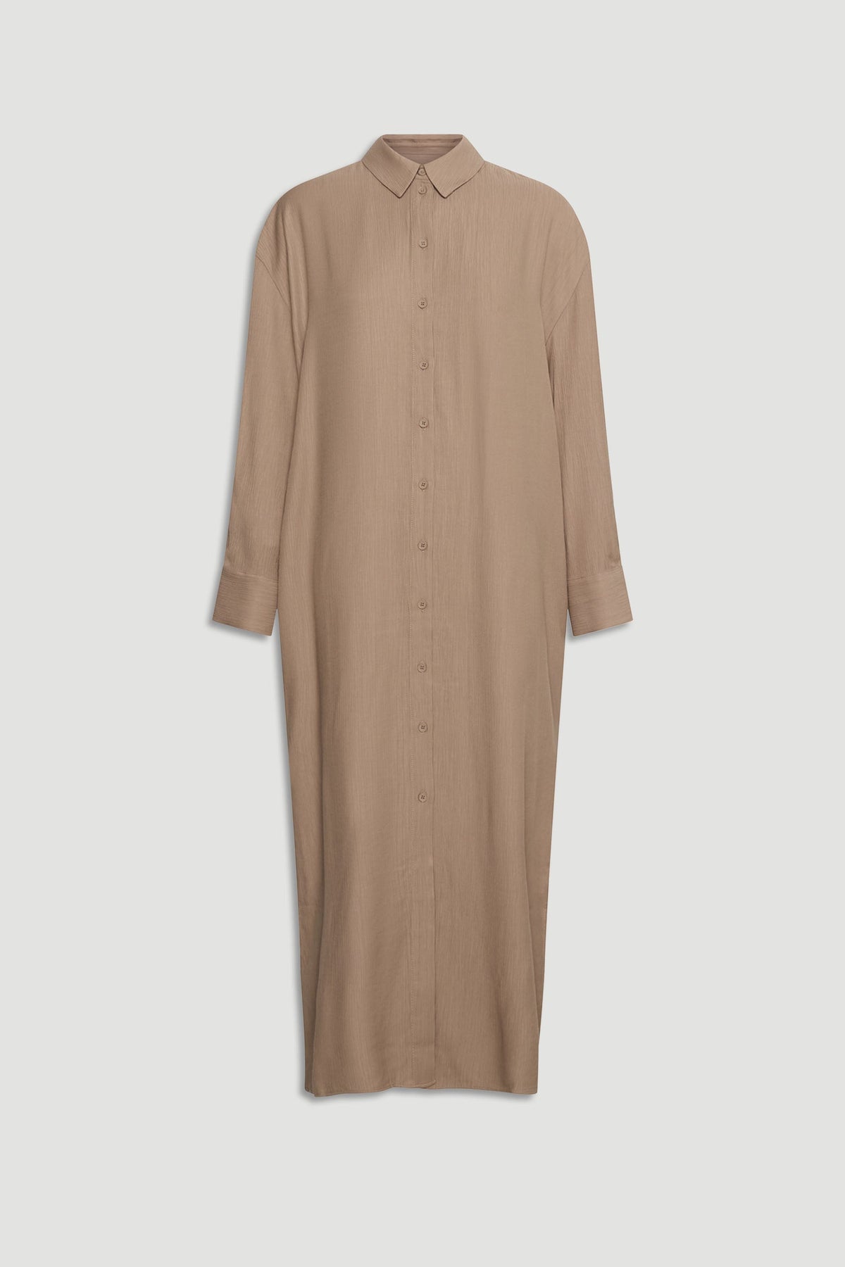 Long textured shirt dress in warm beige with full button front and classic collar for effortless style.