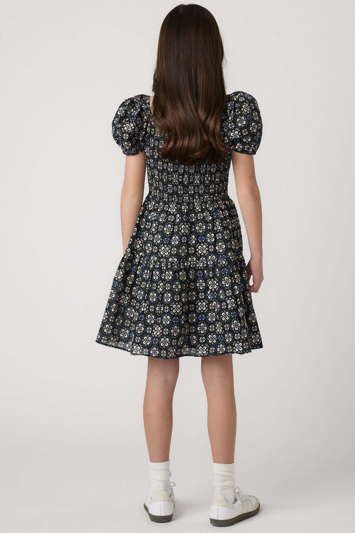 Girls Maude Mini Dress back view with short balloon sleeves and flowy skirt in a floral print, gallery position 2 portrait