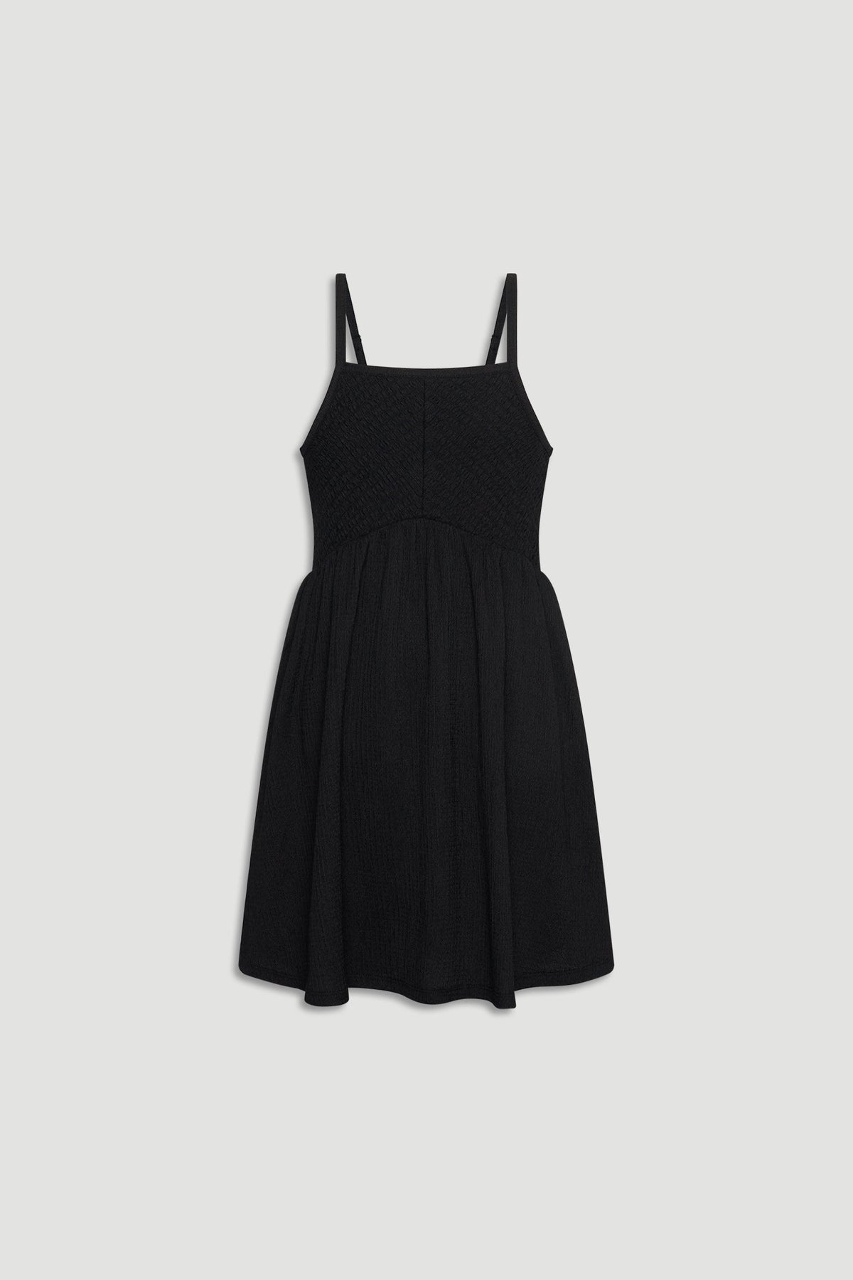 Black shirred girls dress with thin straps and a gathered skirt for an easy, stylish look.