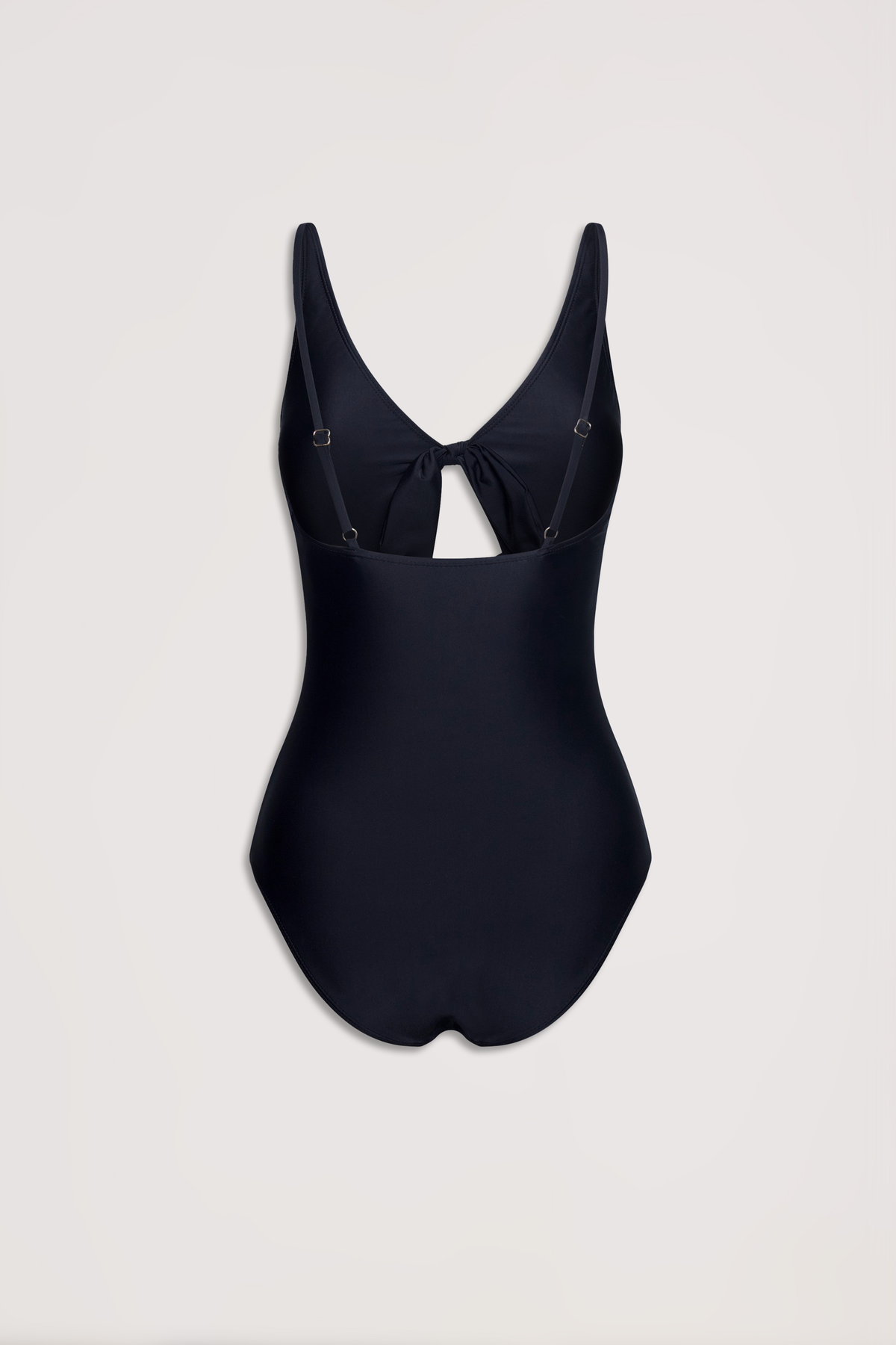 Black one-piece swimsuit featuring adjustable straps and a stylish tie detail at the low back cutout.