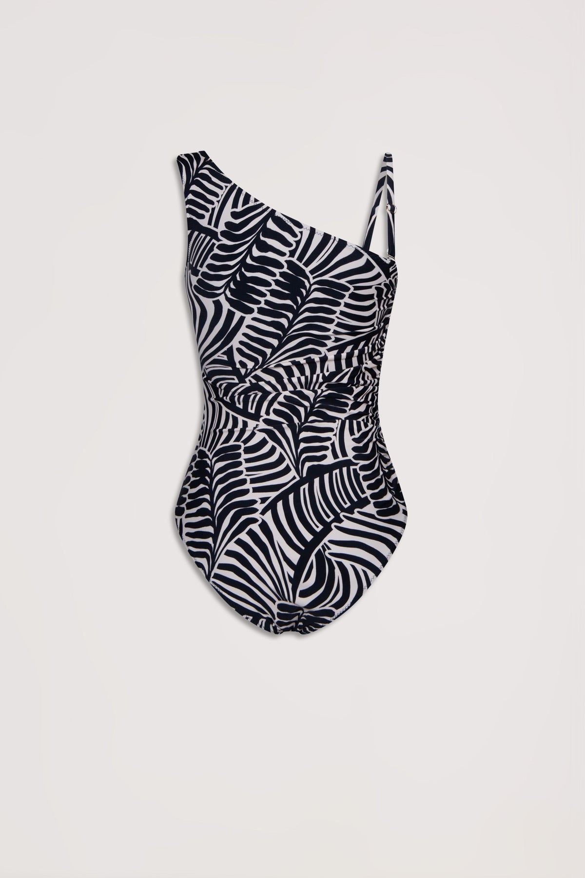 Black and white matte one-shoulder swimsuit with an abstract palm leaf pattern and subtle ruching detail