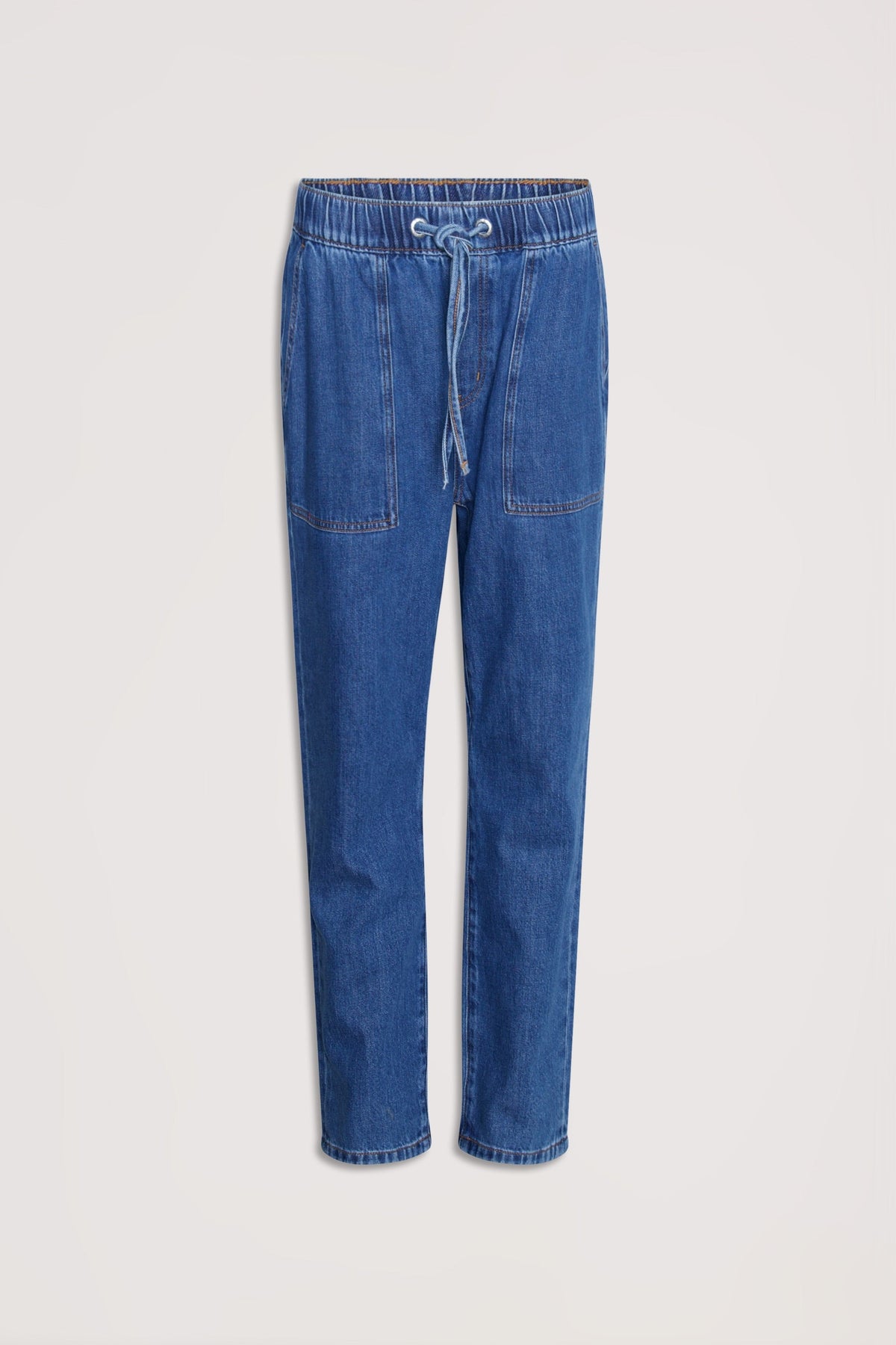 Relaxed fit blue denim joggers with an elasticated waistband and front patch pockets for casual, comfortable wear.