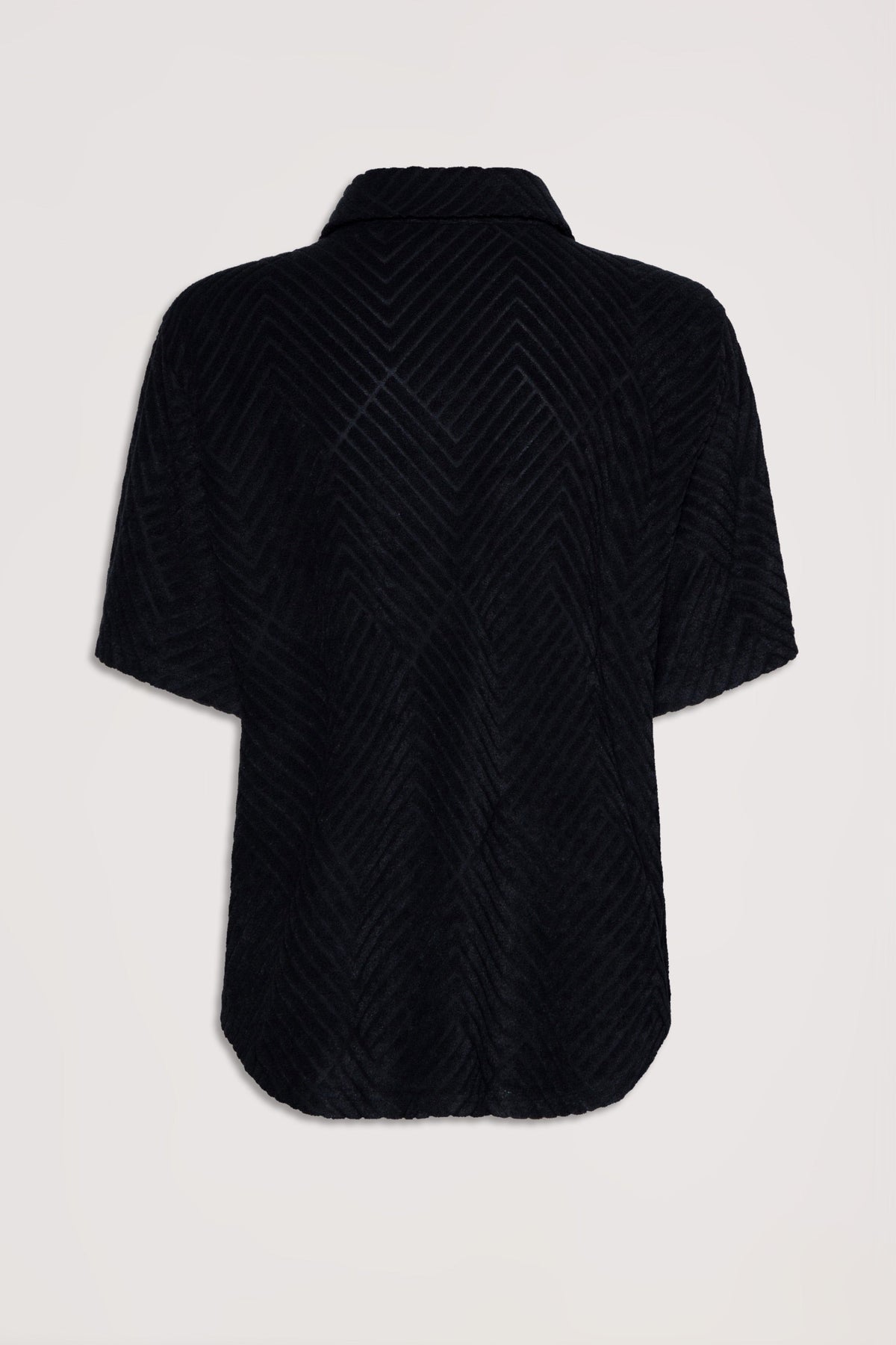 Black terry fabric shirt with chevron texture and short sleeves, shown from the back with a relaxed fit collar.