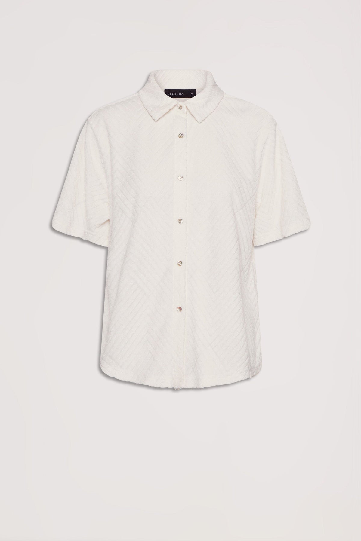 Cream-colored short sleeve shirt with subtle textured pattern and button front, featuring a classic collar design