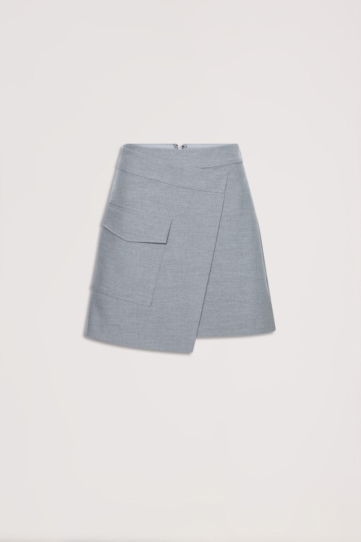 Light grey asymmetric mini skirt with front flap pocket and concealed back zipper, laid flat on neutral background
