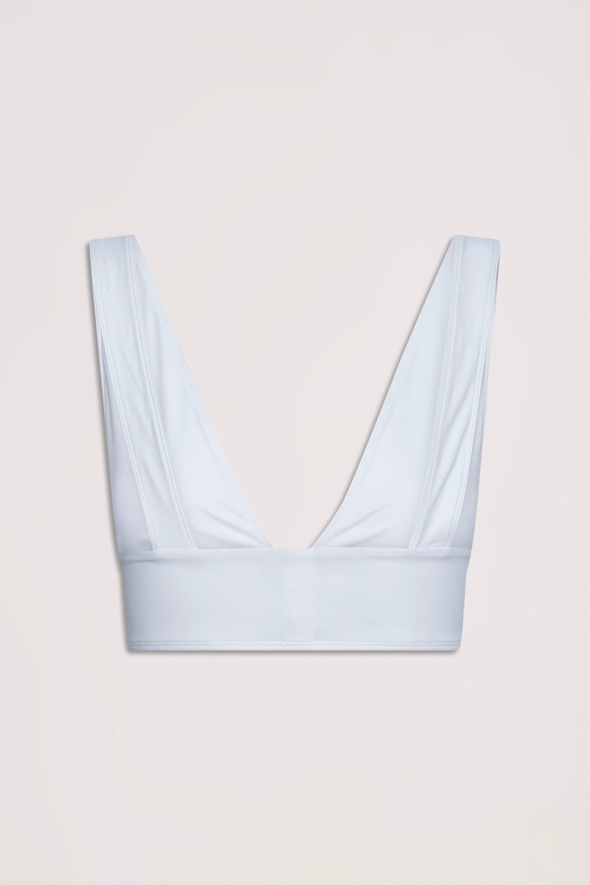 Ivory bralette with wide straps and deep V neckline designed for a neat, comfortable fit in stretch fabric.