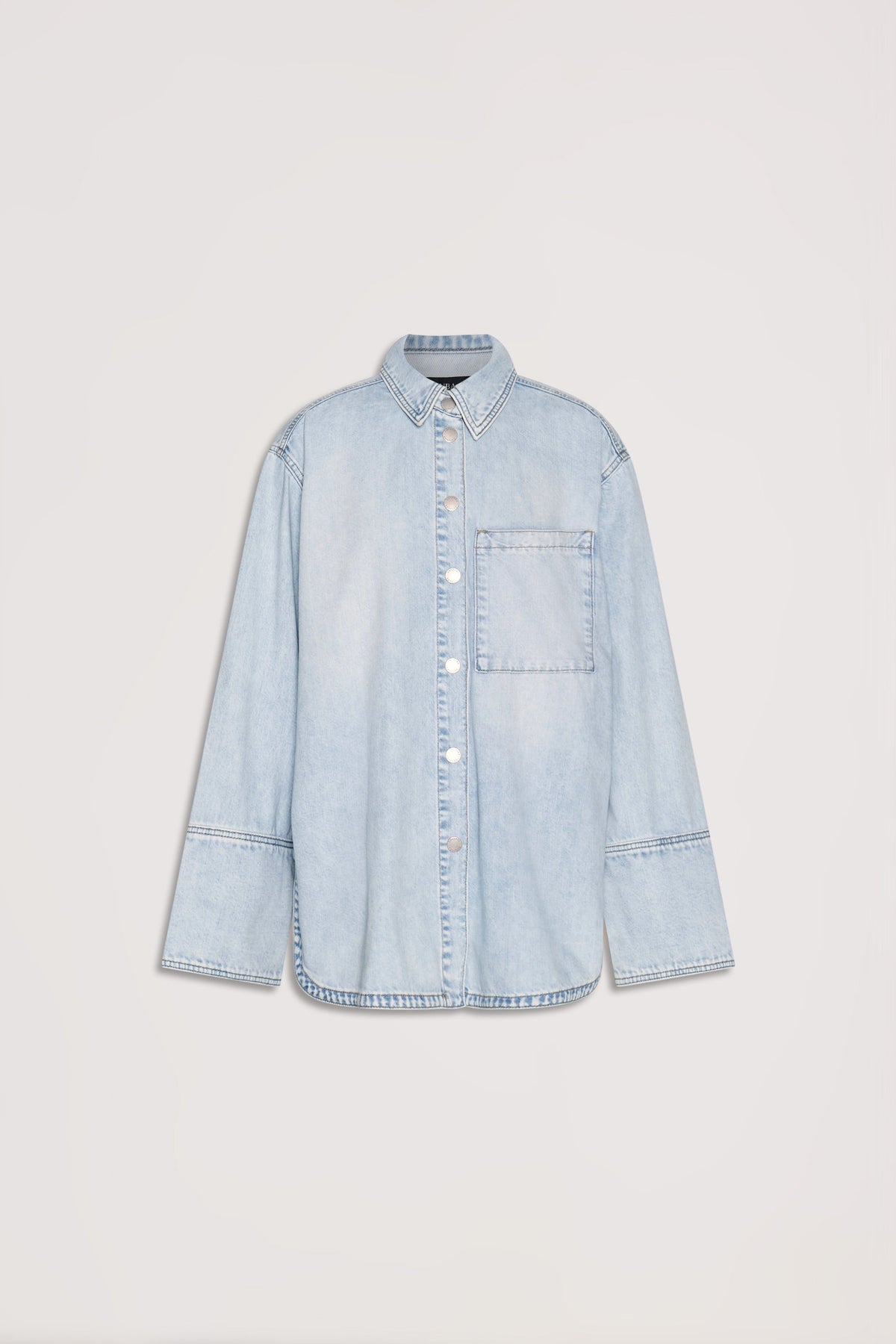 Light wash denim shirt with long sleeves, front buttons, and a single chest pocket for a relaxed everyday look.