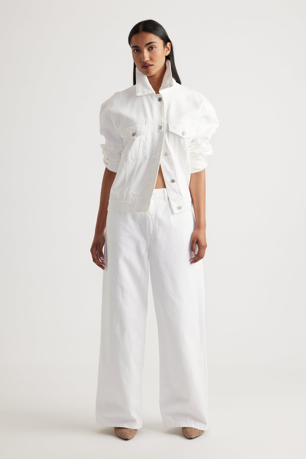 Model showcasing Elena Wide Leg Jean in crisp white denim styled with matching white jacket by Decjuba Australian brand