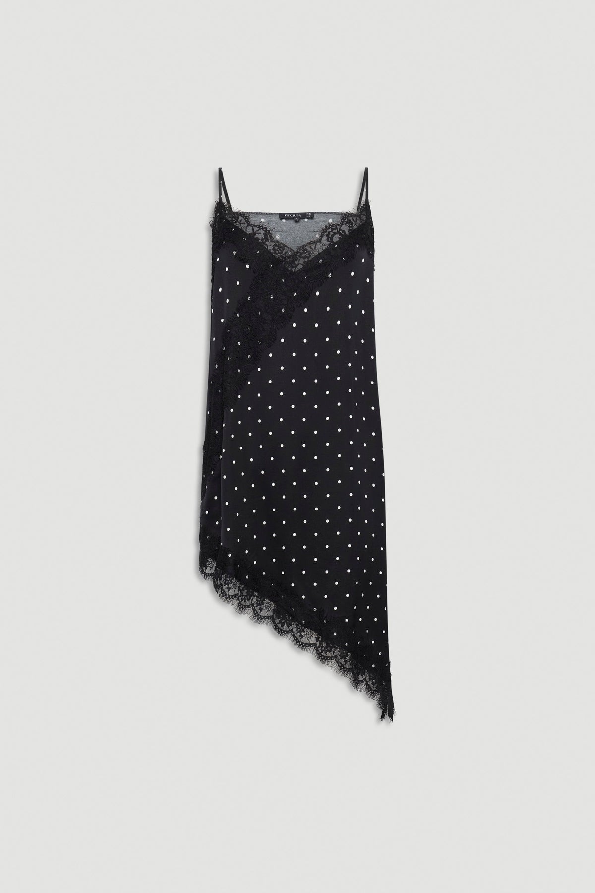 Black asymmetric tunic with white polka dots, delicate lace trim, thin adjustable straps, and soft textured fabric