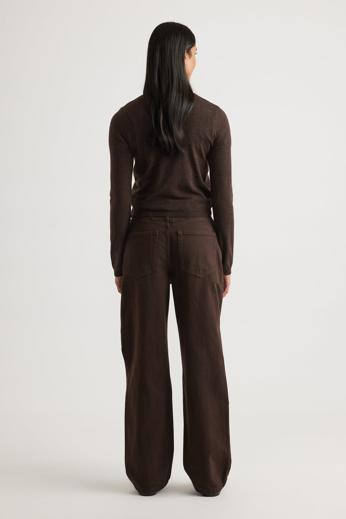 Woman wearing Bella Button Through Cardigan in rich chocolate brown, styled with matching wide-leg pants by DECJUBA.