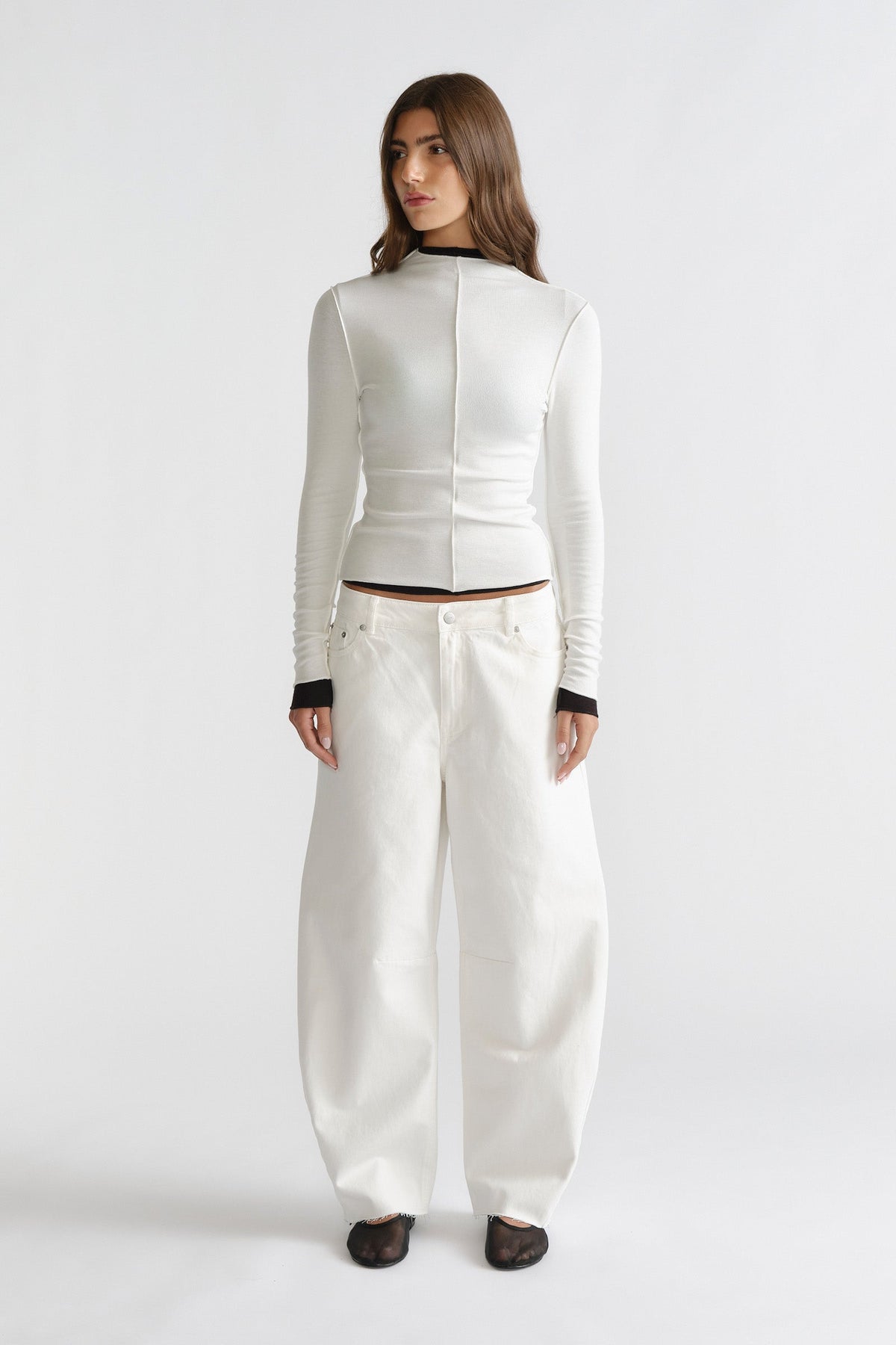 D-Luxe Horseshoe Jean in relaxed white denim with wide-leg silhouette styled with a fitted long-sleeve top by DECJUBA Australian brand