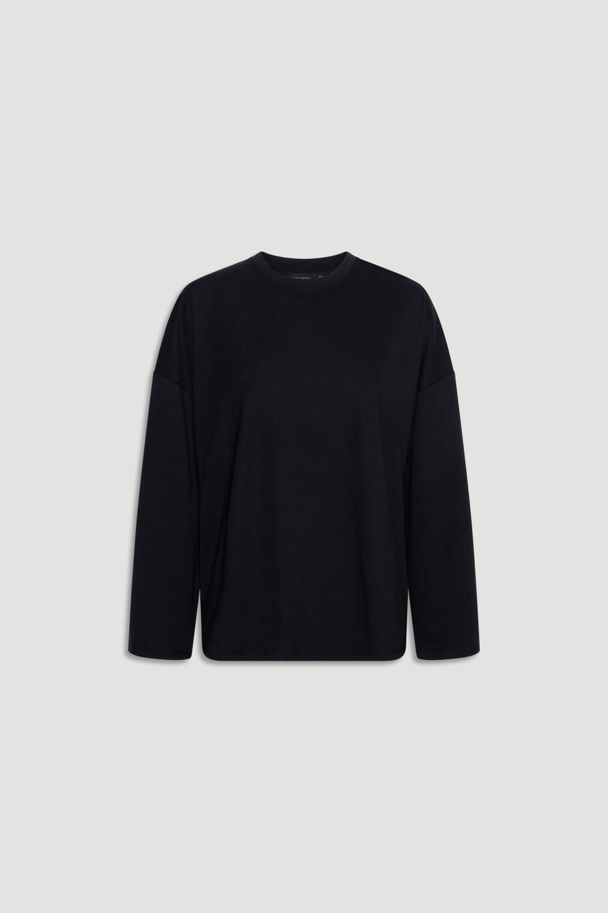 Minimalist black long sleeve top with a relaxed fit and subtle crew neckline for versatile everyday wear
