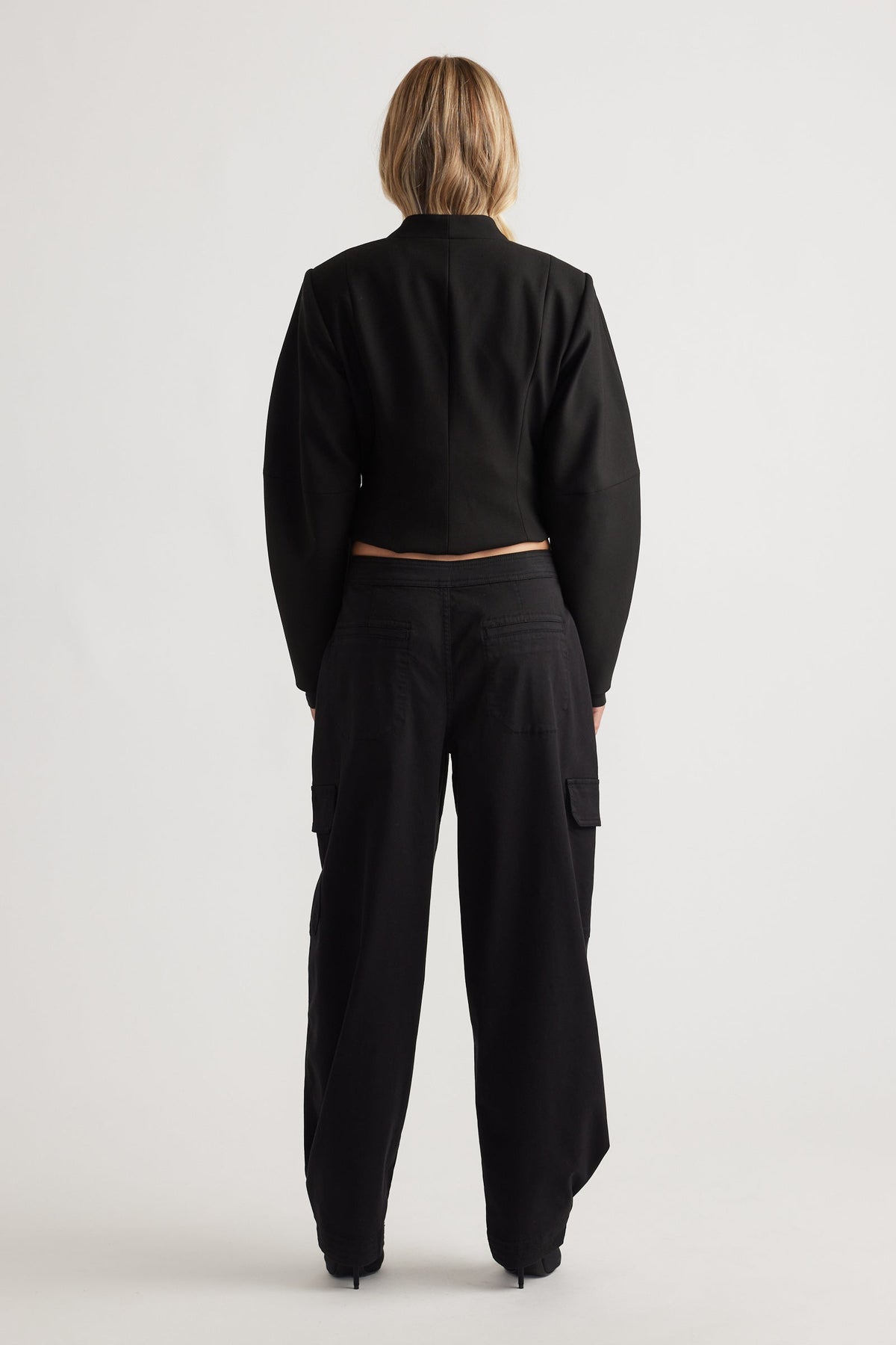 Back view of Peyton Zip Cargo Pocket Pant in black with relaxed fit and functional side pockets for everyday style and comfort