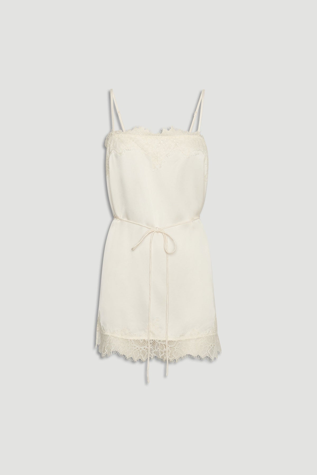 Ivory lace-trimmed slip cami with delicate straps and a thin waist tie for a soft, elegant silhouette