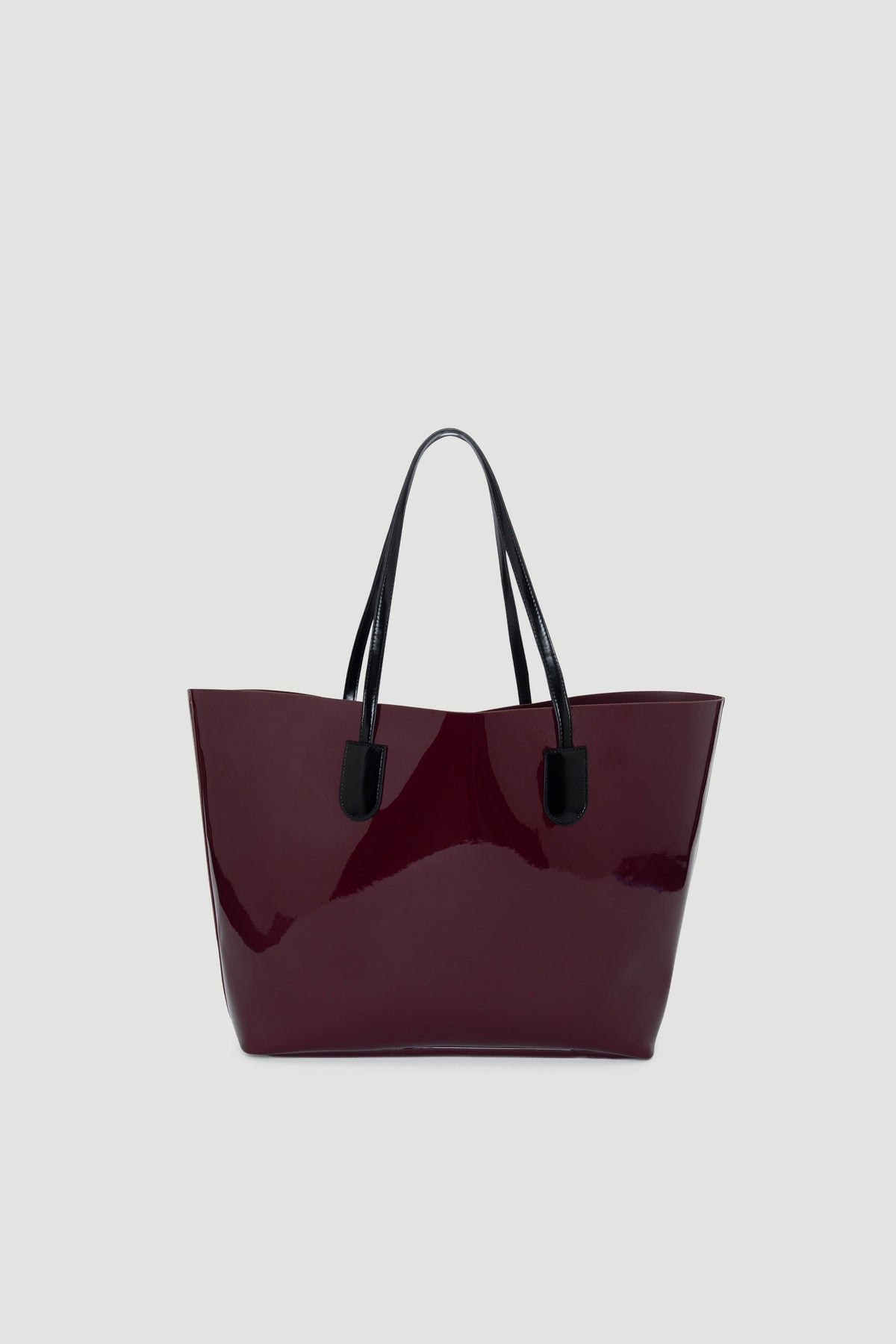 Glossy plum tote bag with black handles, featuring a sleek, structured silhouette for everyday style.