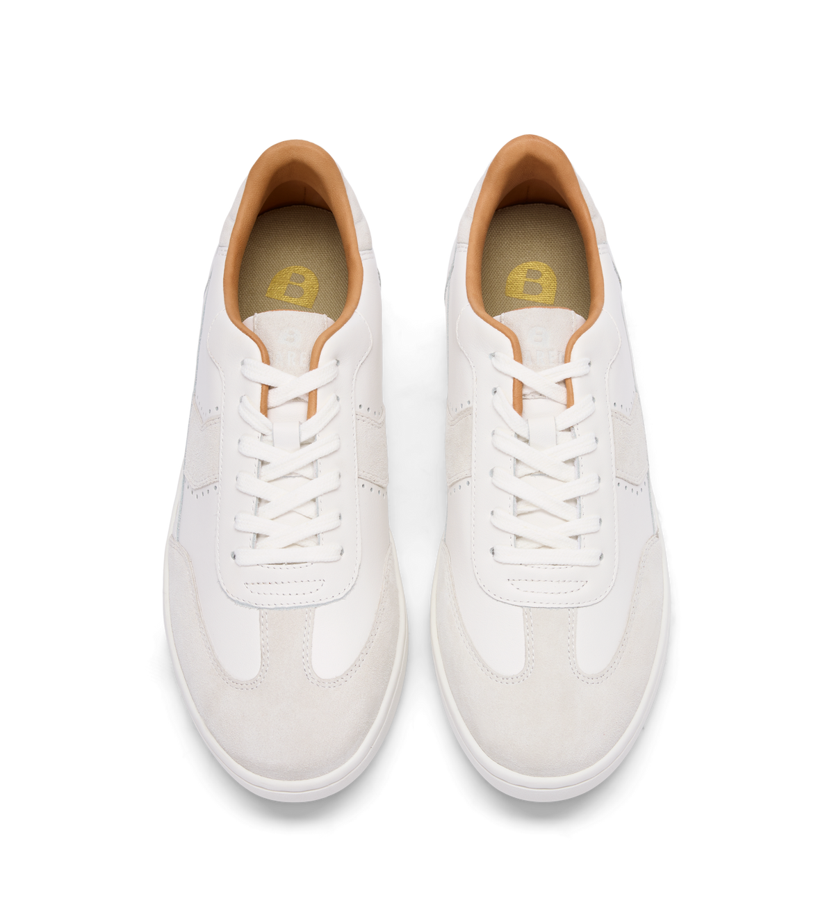 pair of womens white sneakers with white laces