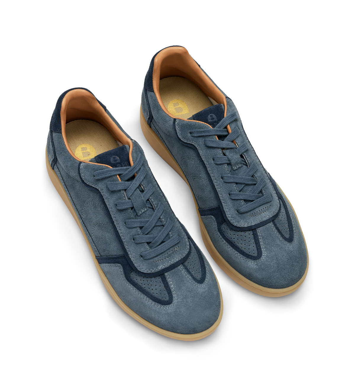 Pair of blue suede sneakers with brown soles on a white background
