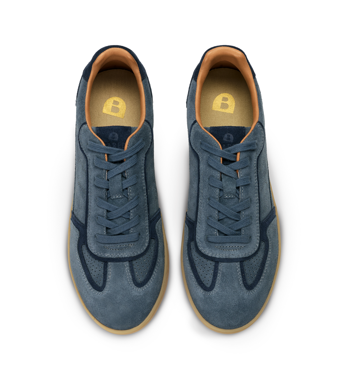 Pair of blue sneakers with brown soles on a white background