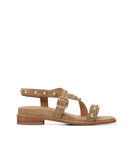 Tan sandal with gold straps and buckles on a white background
