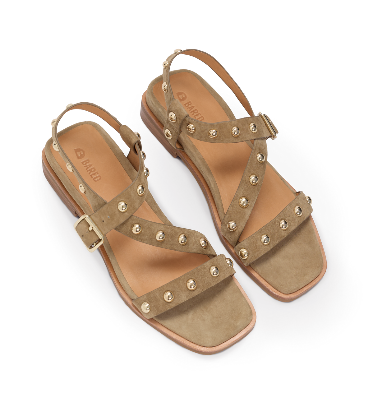 Pair of tan sandals with gold embellishments on a white background