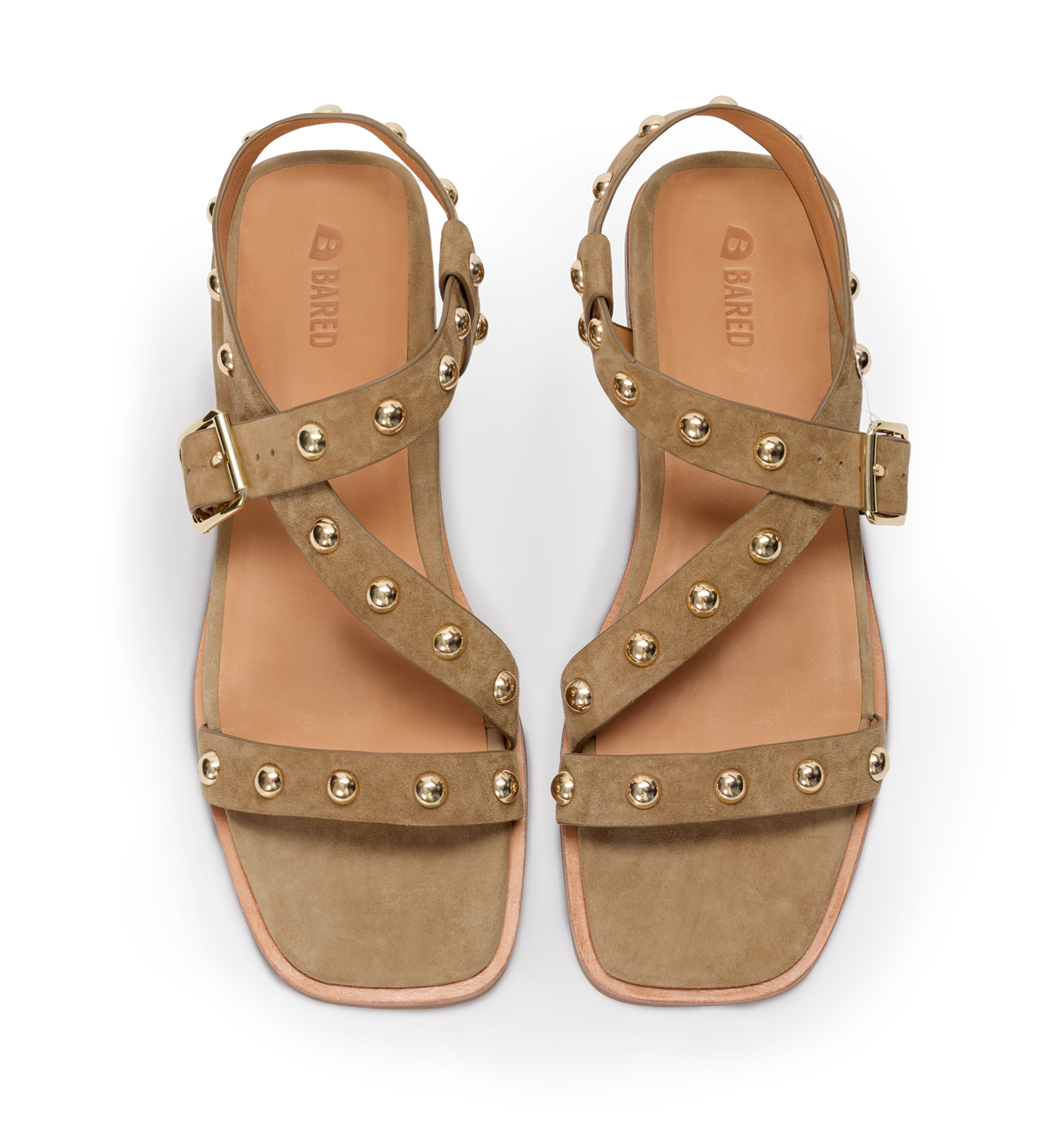Pair of tan sandals with gold studs on a white background