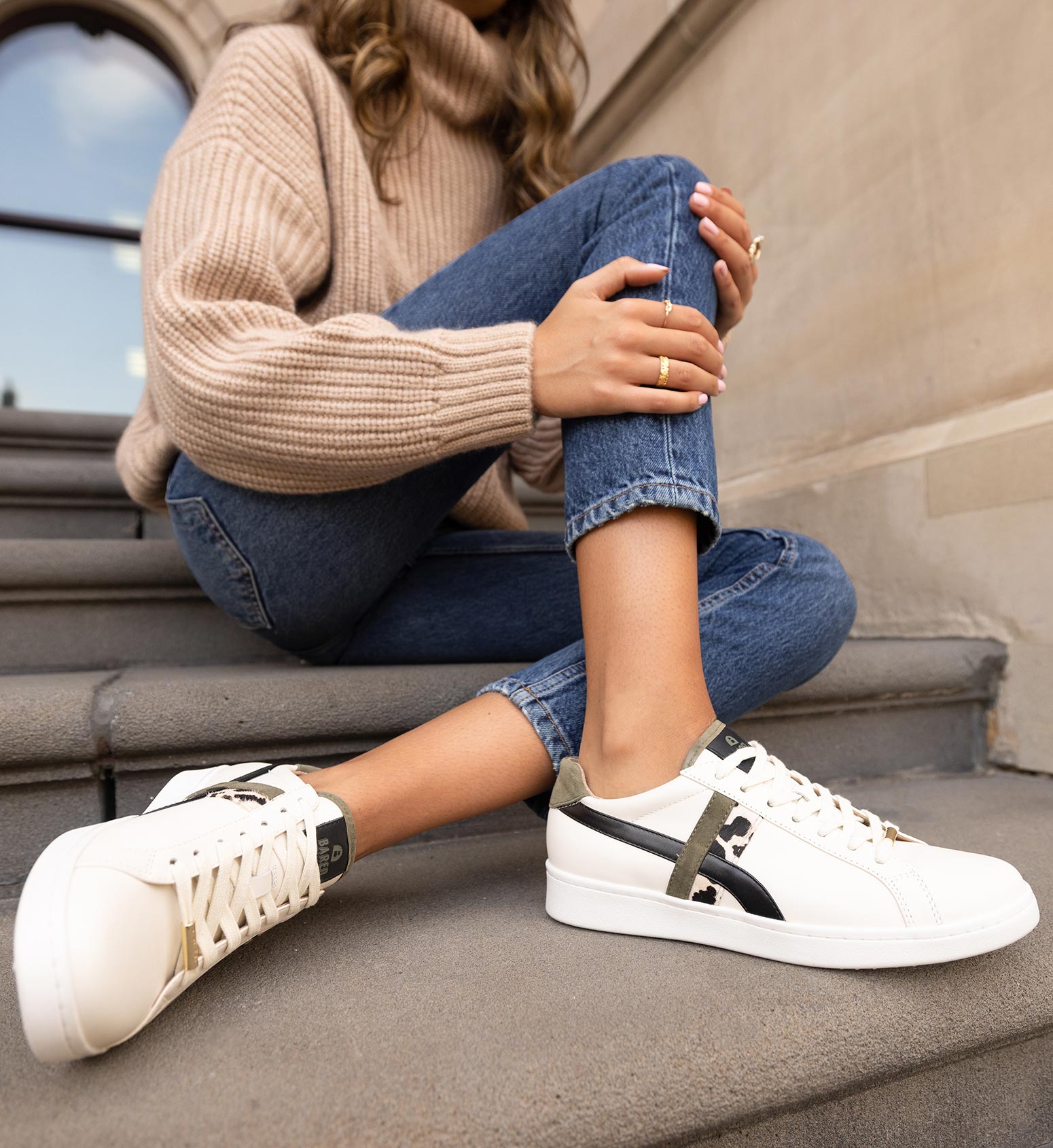 women's ecru leather sneaker with black and leopard print detailing with denim