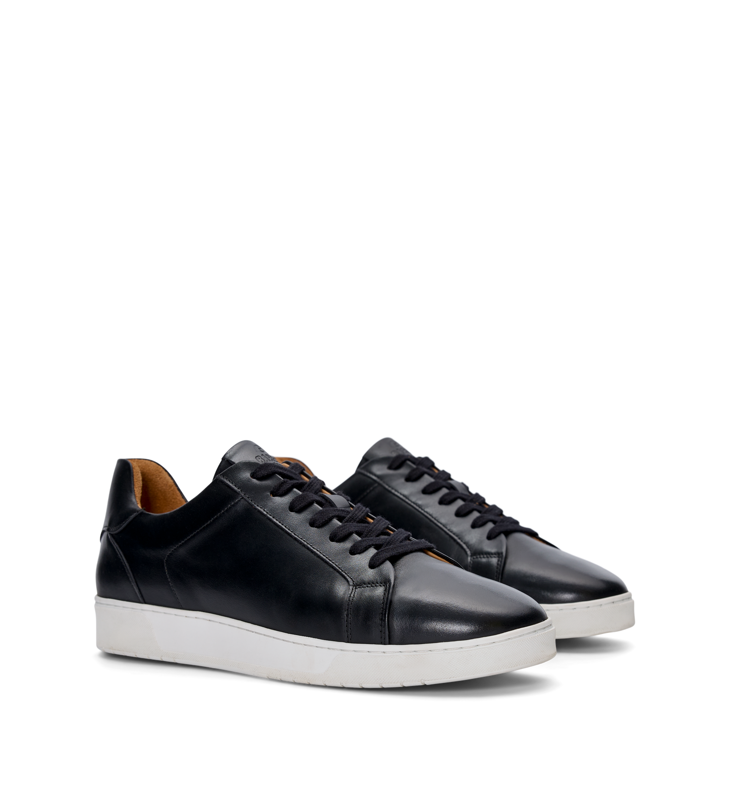 pair of mens black sneakers with a white sole