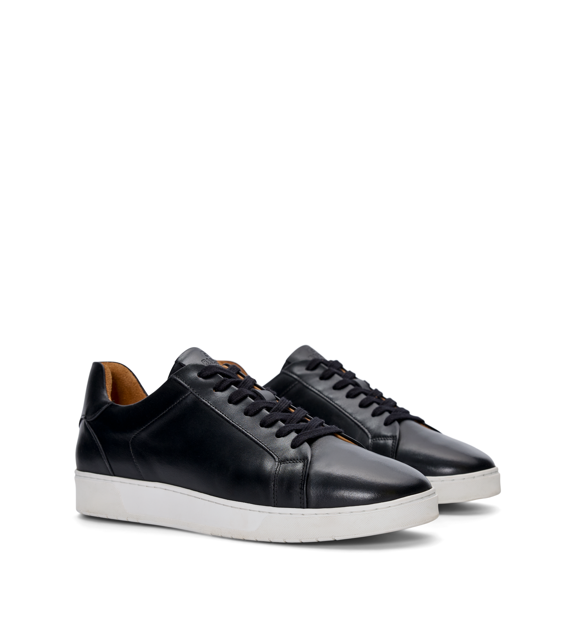 pair of mens black sneakers with a white sole