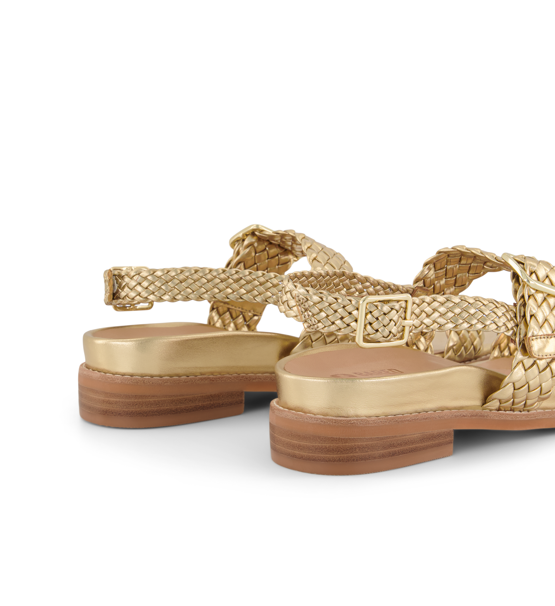 close up on the ankle strap of the bristlefront gold sandals