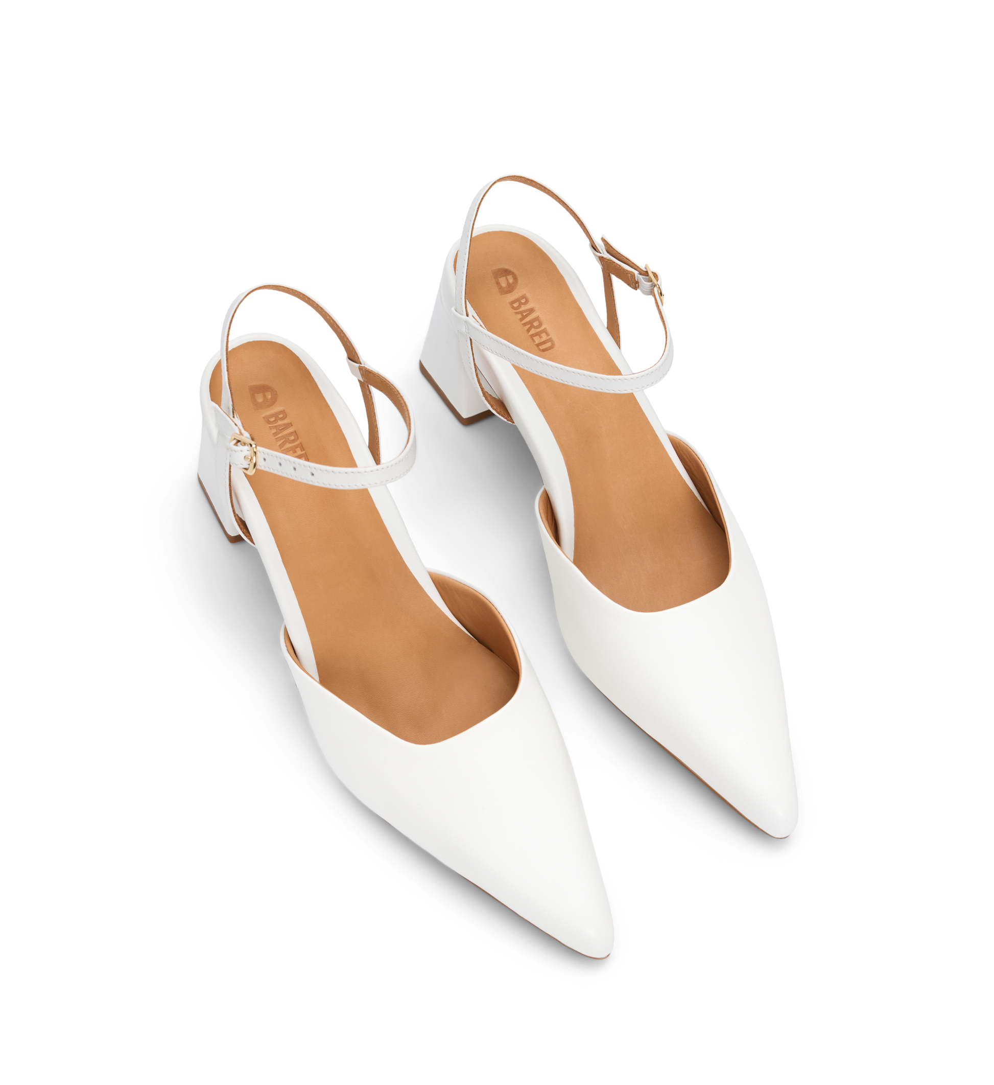 Bared Footwear White pointed-toe heels with tan insoles on a white background