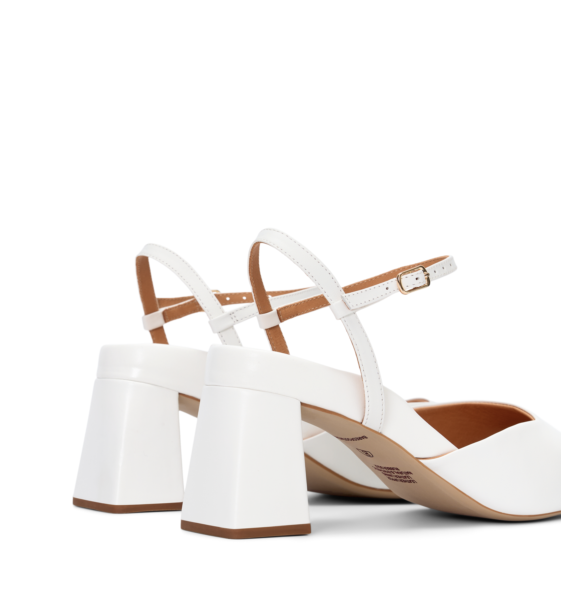 White high-heeled shoes with brown soles on a white background