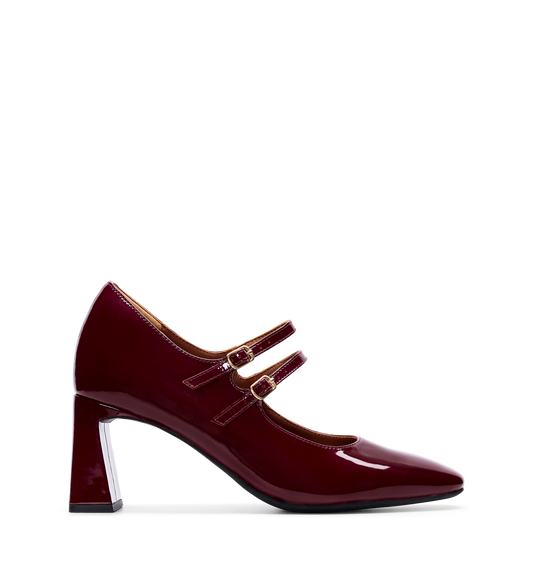 A single dark cherry red patent leather high heel shoe with a glossy finish, double strap design, and gold hardware.