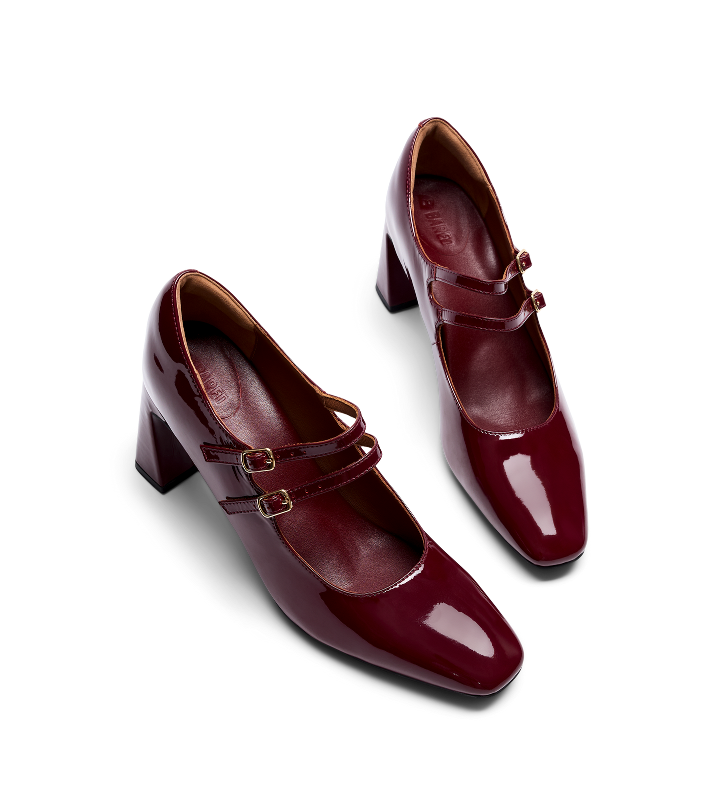 pair of cherry red mary jane heels