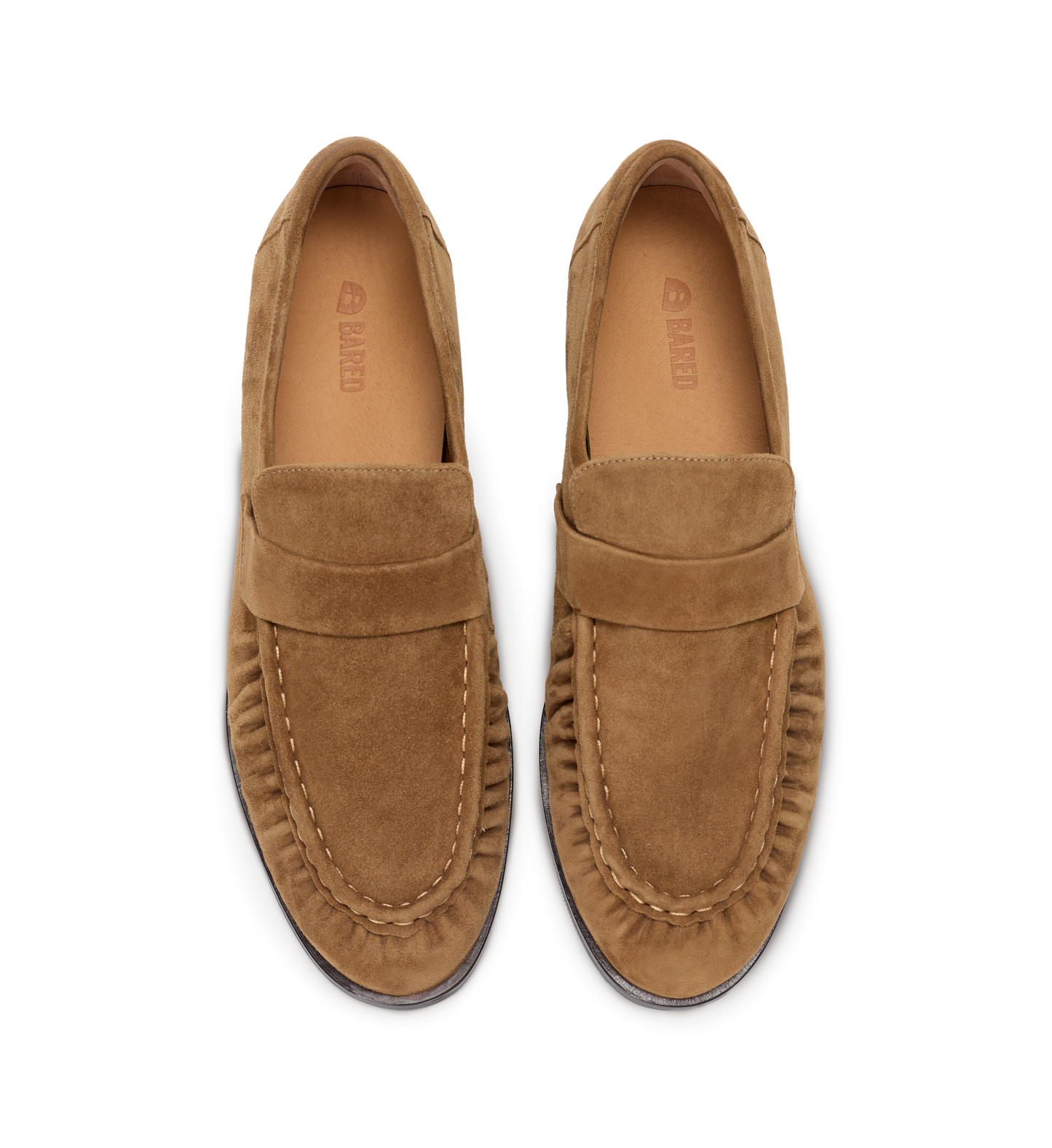 Pair of tan loafers on a white background