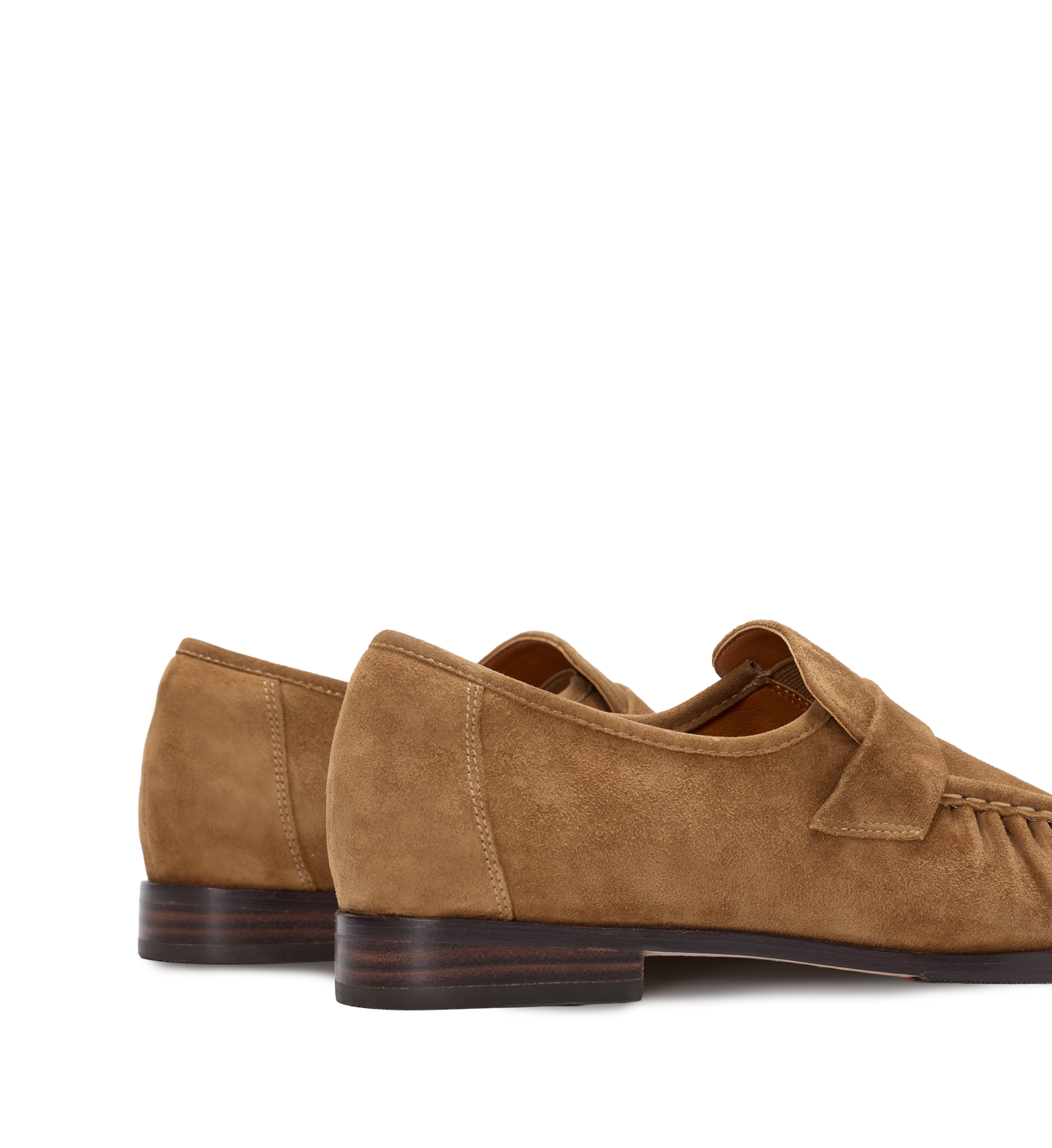 Pair of brown suede loafers on a white background