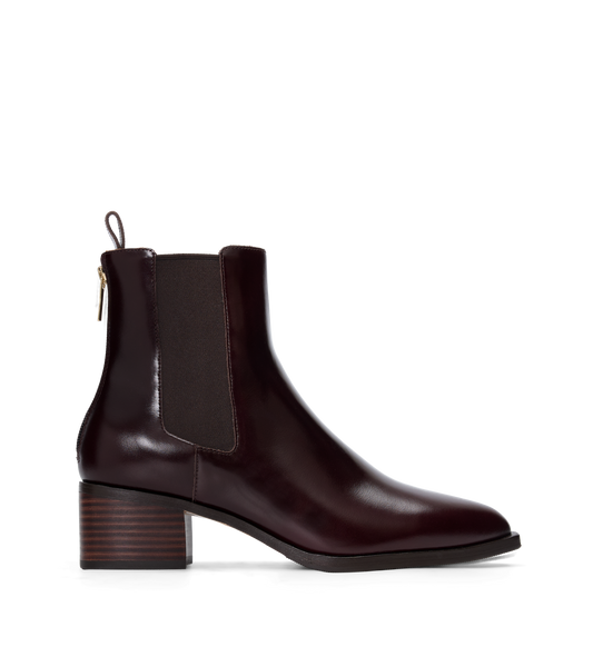 Brown leather ankle boot on a white background