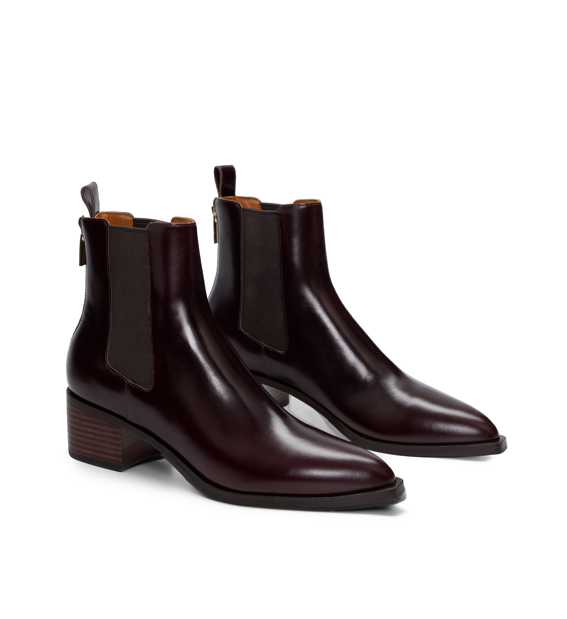 Pair of brown leather Chelsea boots on a white background