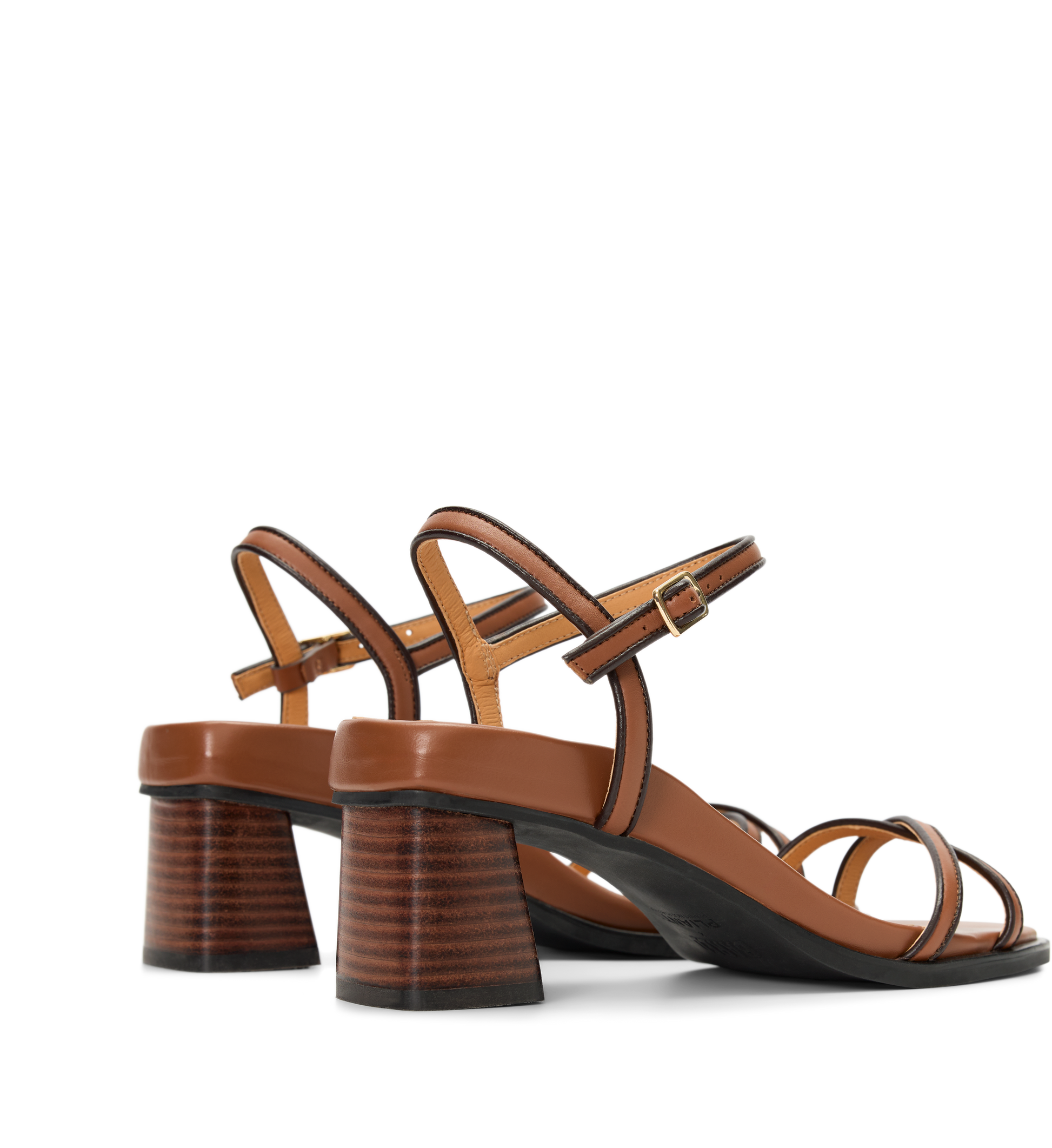 Brown high-heels with black striped design on a white background