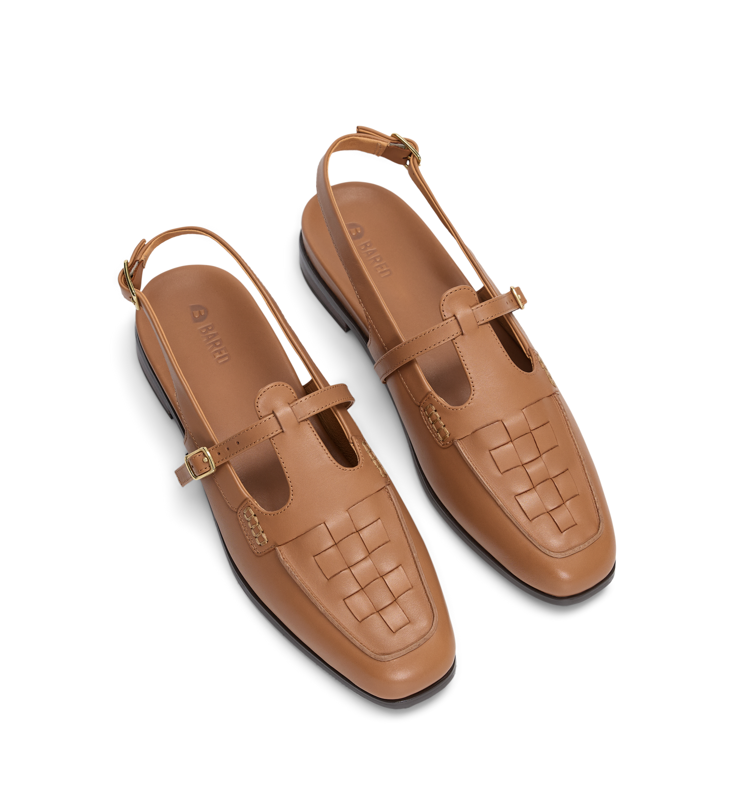 Pair of tan loafers with a woven pattern on a white background