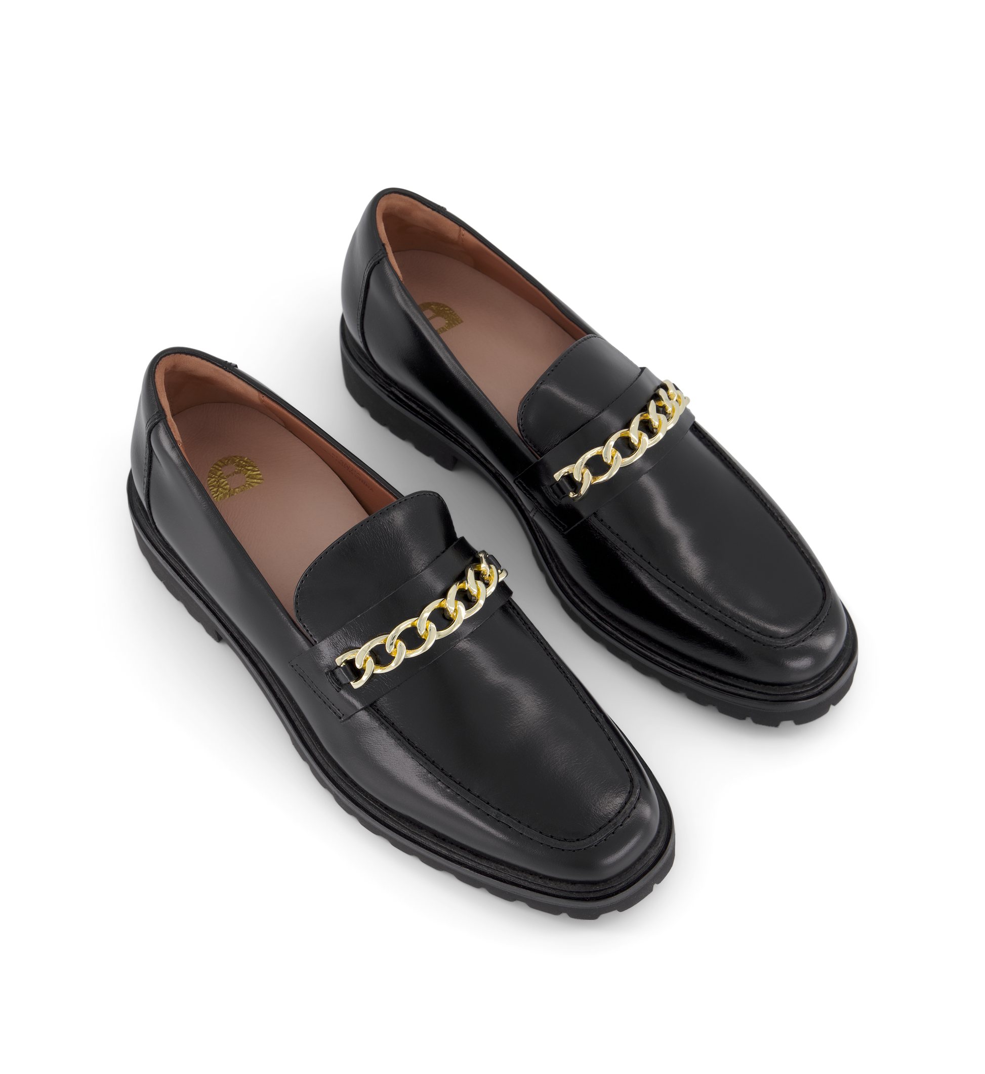 pair of chunky black leather loafers with a gold chain on the front 