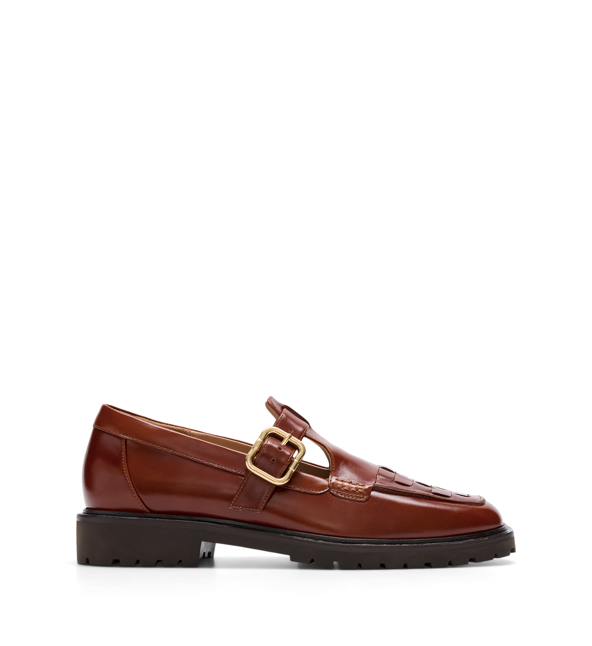 A brown leather loafer with a T-bar strap and adjustable buckle, featuring intricate brogue detailing and a chunky rubber outsole.
