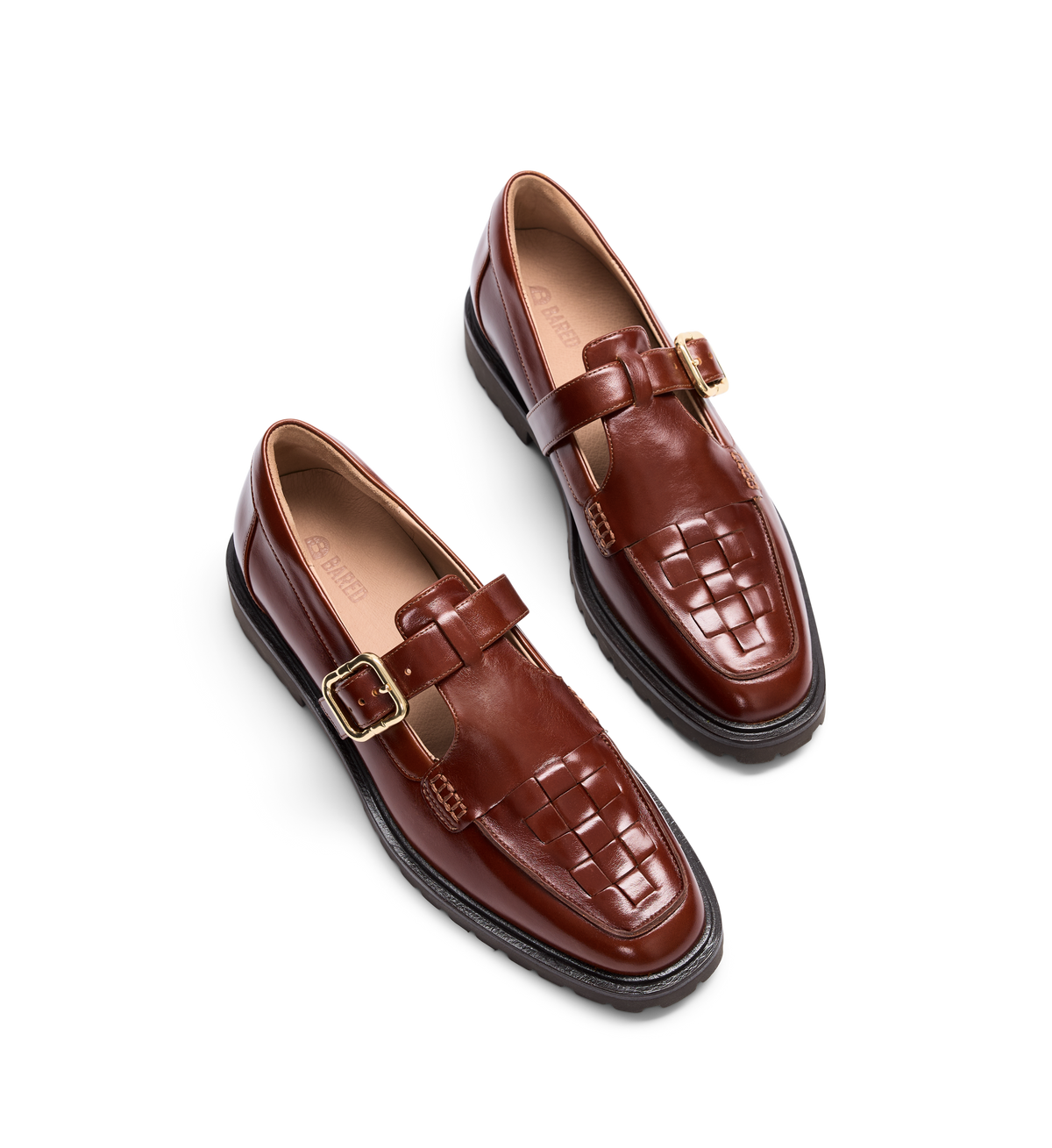 pair of womens brown loafers with t bar strap and woven detail