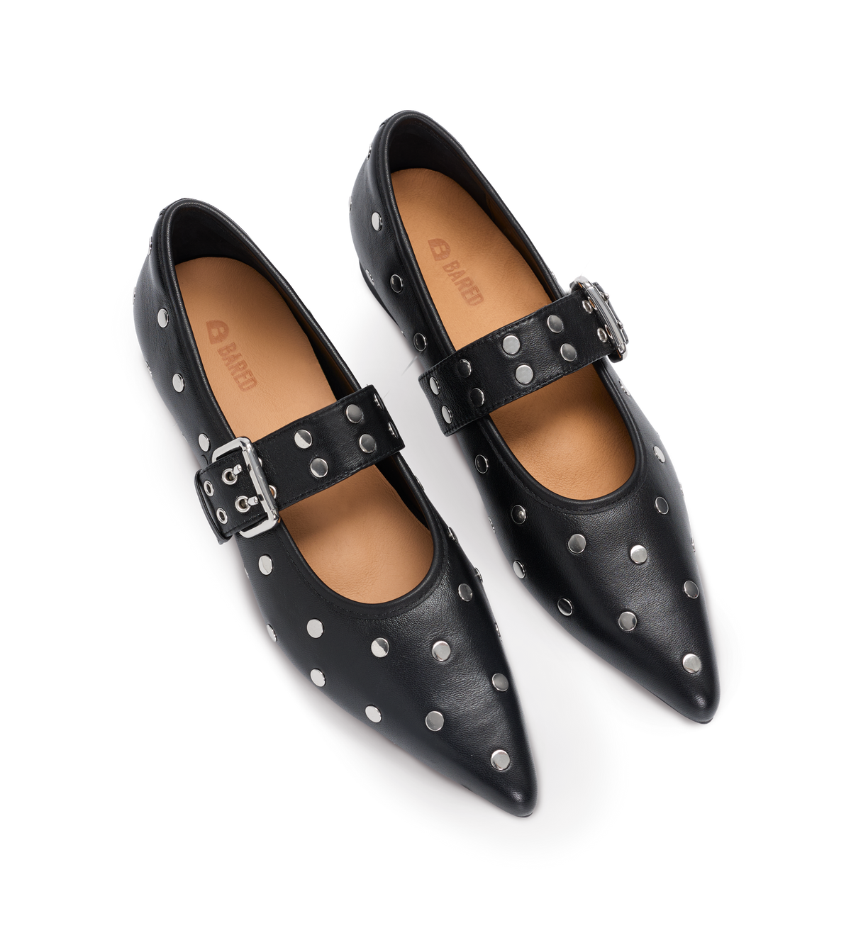 Black studded ballet flats with buckles on a white background