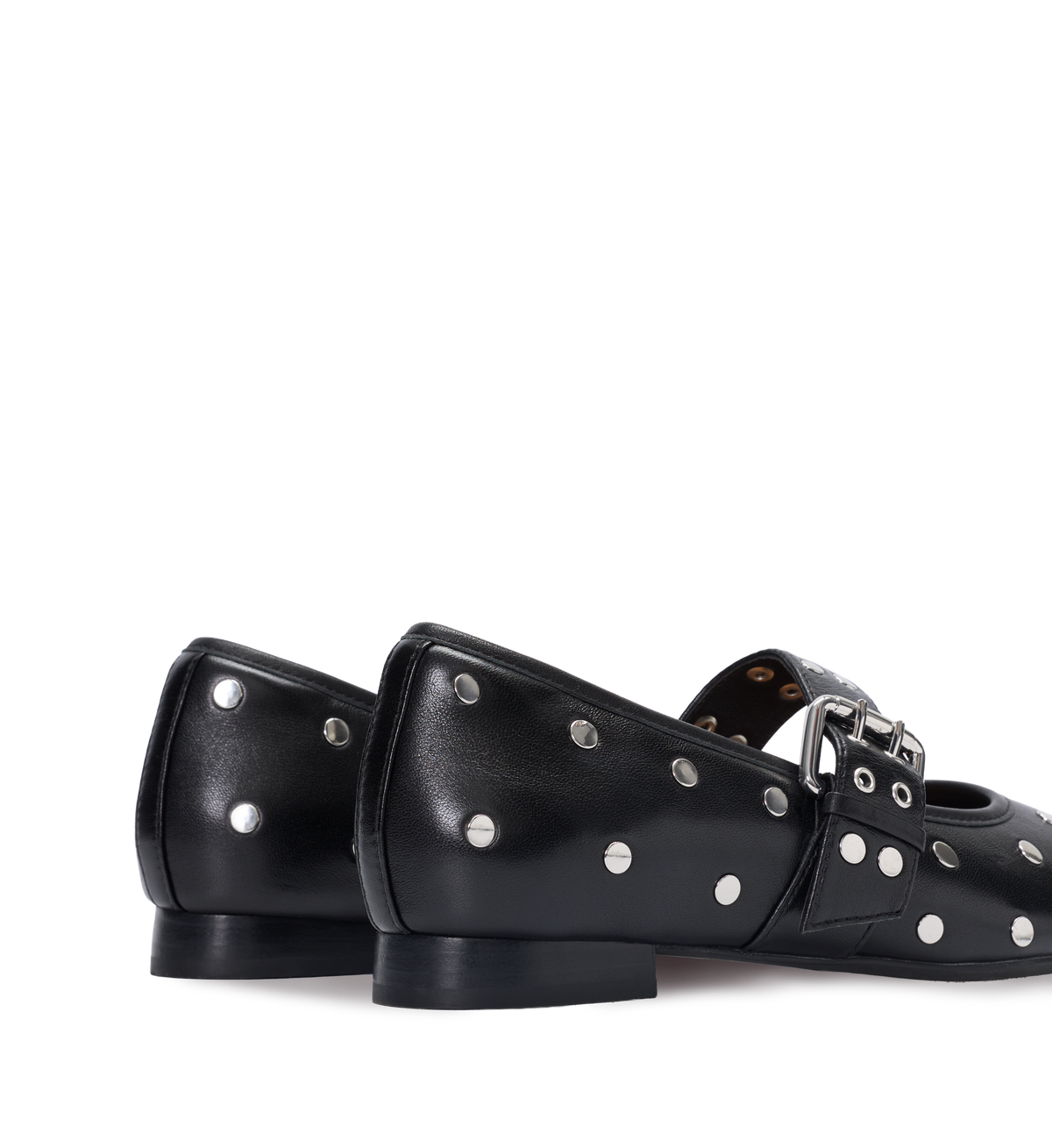 Black leather shoes with silver studs and buckles on a white background