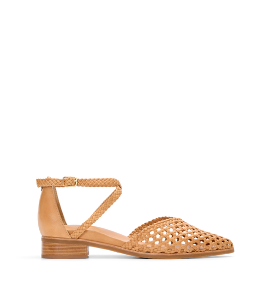 A light tan leather sandal with a supportive heel counter, cross over ankle straps, and a spacious pointed toe. The hardware color is gold.
