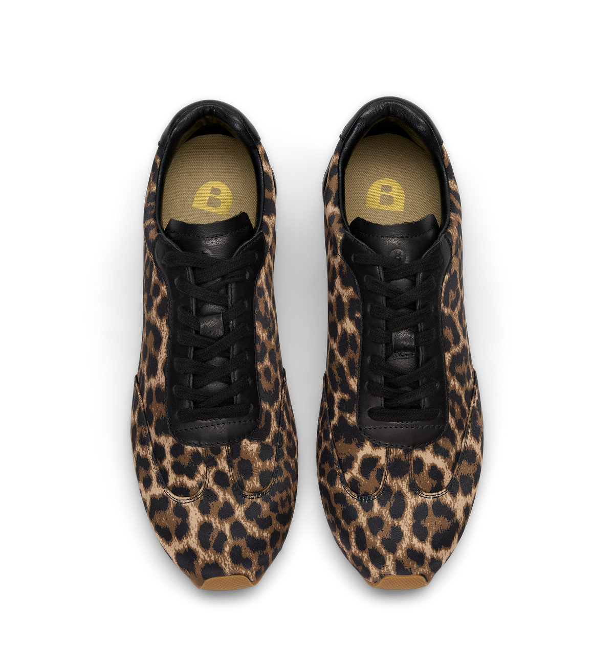 Leopard print sneakers with black accents on a white background