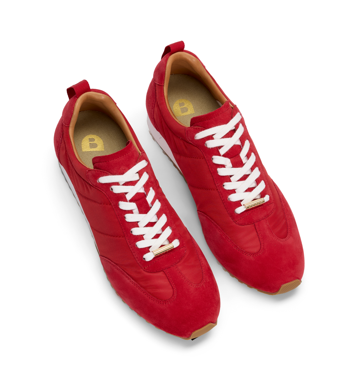 Red sneakers with white laces on a white background